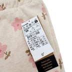 Pantalon beige à fleurs roses - 9 mois