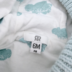 Veste bébé bleu clair à capuche en grosse maille - 6 mois