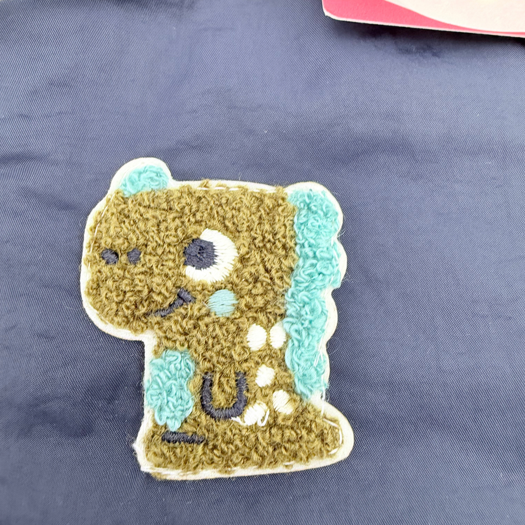 Veste bébé déperlante bleu marine et écru à capuche - 6 mois