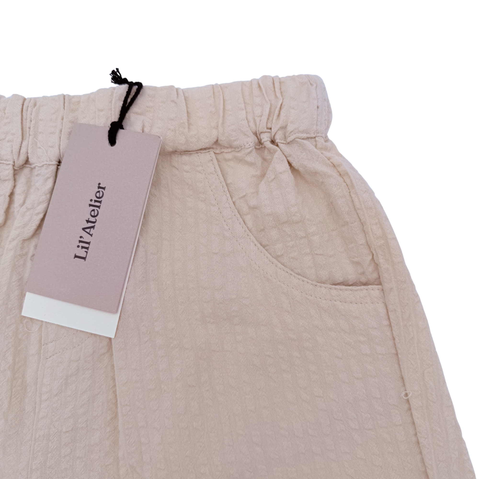 Short texturé beige — 6-7 ans