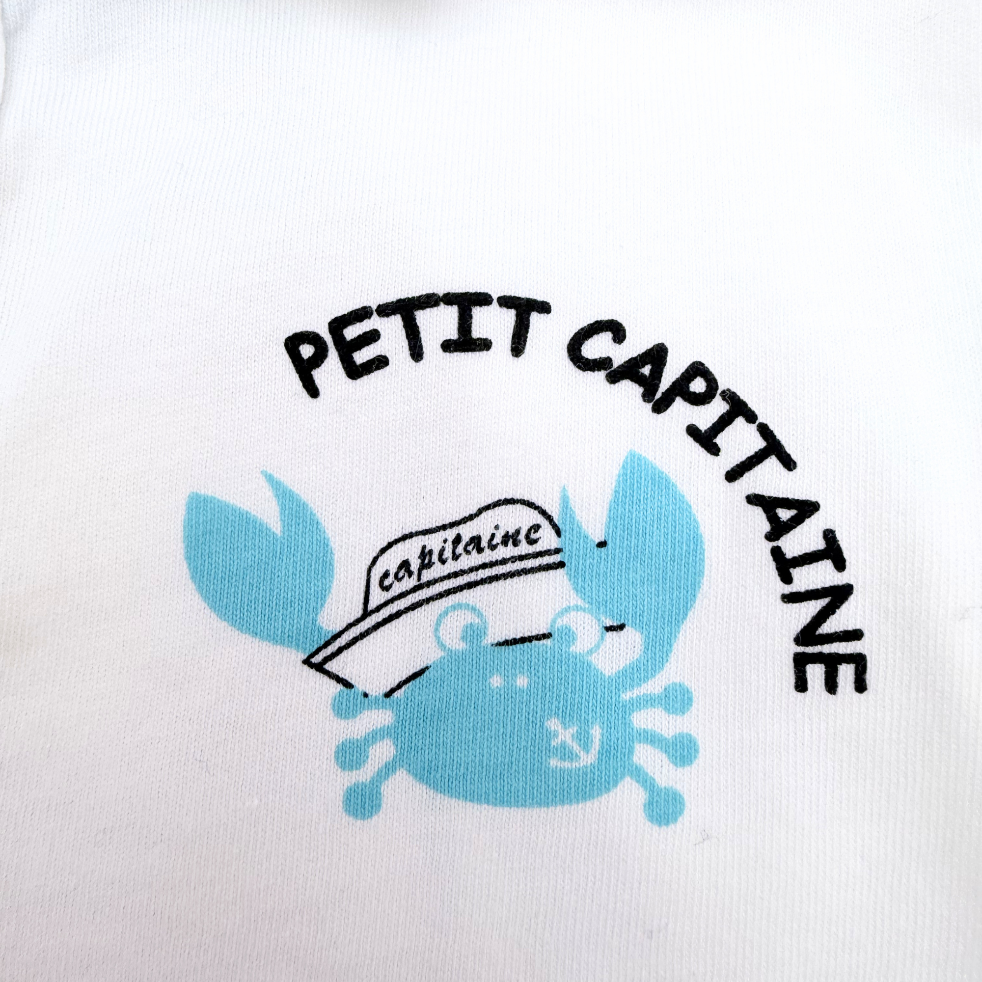 Polo blanc et bleu “Petit Capitaine” — 24 mois
