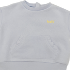 Sweat bleu clair avec poche volantée - 6 mois