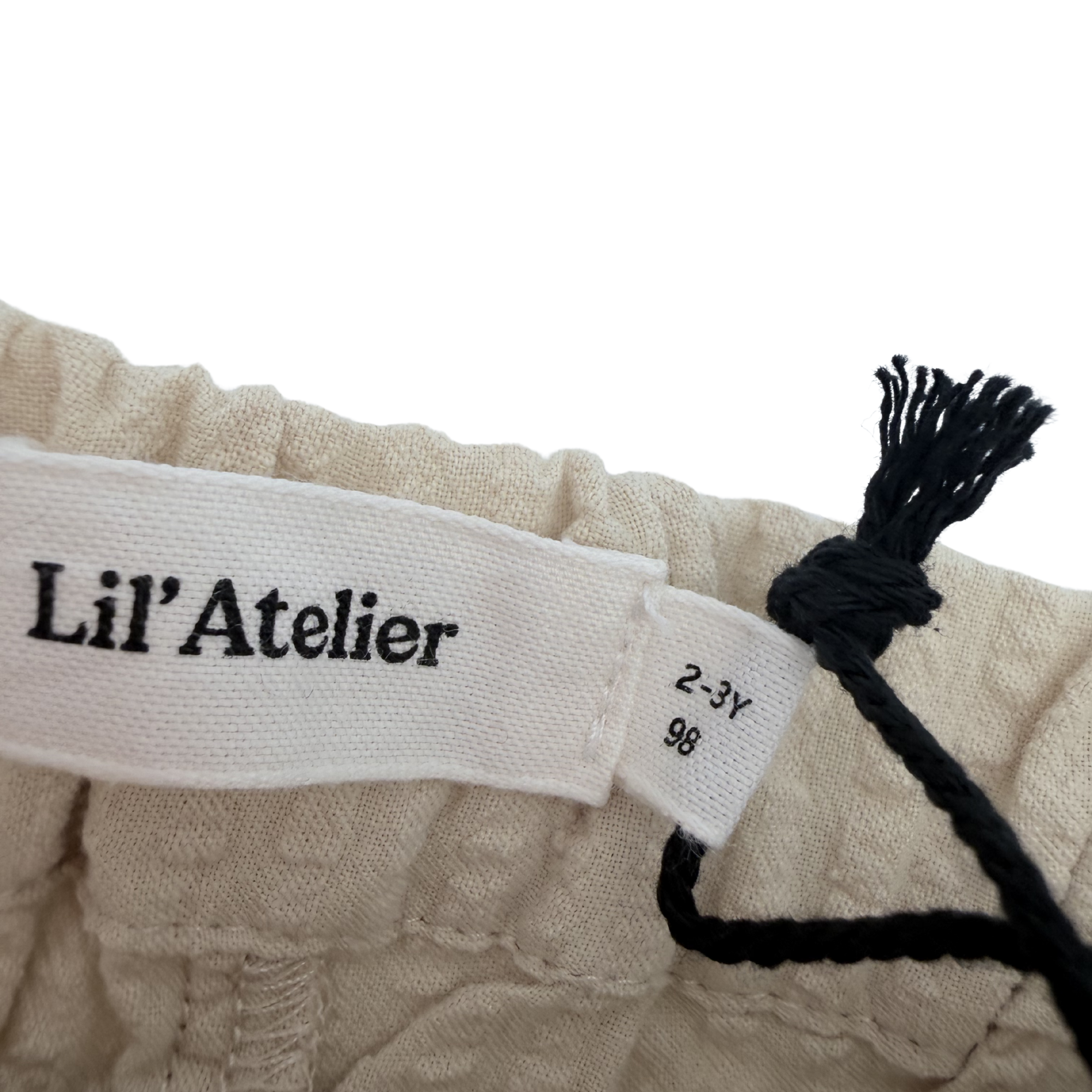 Short texturé beige — 2-3 ans