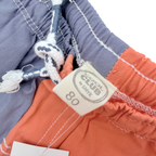 Short bicolore bleu et terracotta – 18 mois