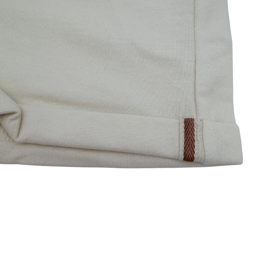Short molleton écru à revers — 2 ans