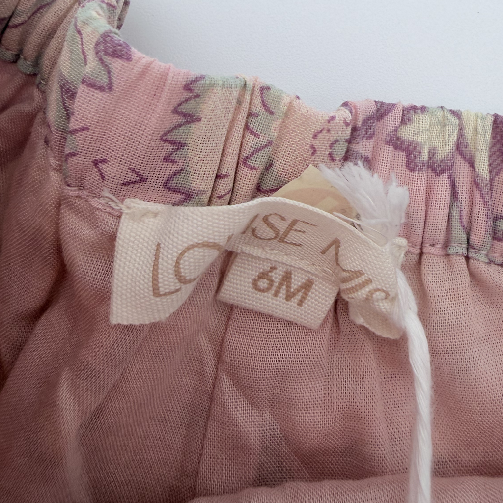 Short fleuri rose à pompons — 6 mois