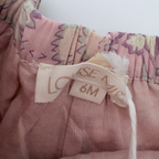 Short fleuri rose à pompons — 6 mois
