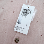 Gilet en maille ajourée rose pâle — 12 mois