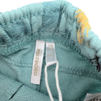 Short bleu imprimé ananas et feuilles — 9 mois